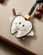 Handmade Leather Tooth Fairy Charm (Smiling Winged Tooth with Toothbrush Version) - Image 2